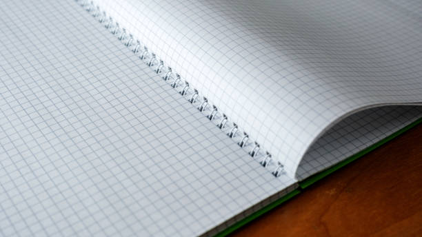 istock Blank pages await creativity in a spiral notebook on wooden table 2201929734