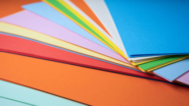 istock Colorful sheets of paper arranged creatively on a vibrant surface 2201929765
