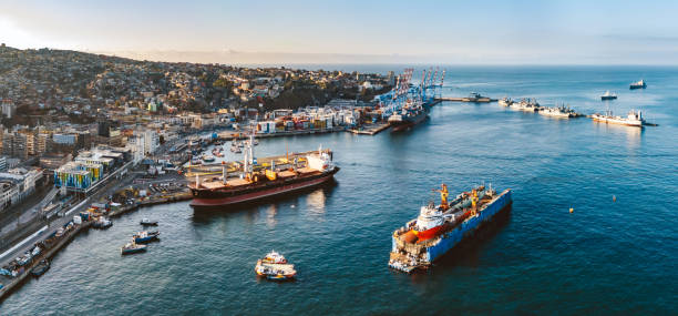 drone view on Harbor and Cityscape of Valparaiso – Chile, Container ships anchoring at the pier