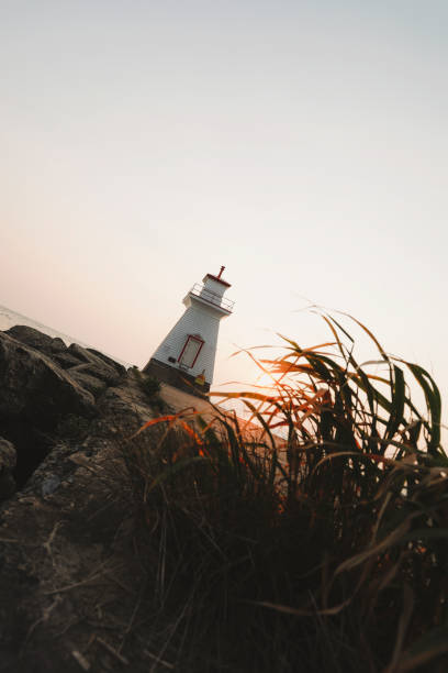 istock Sunset and Lighthouse at the Lake 2201932510