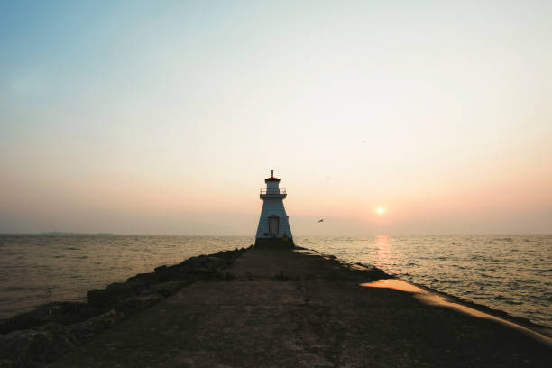 istock Sunset and Lighthouse at the Lake 2201932846