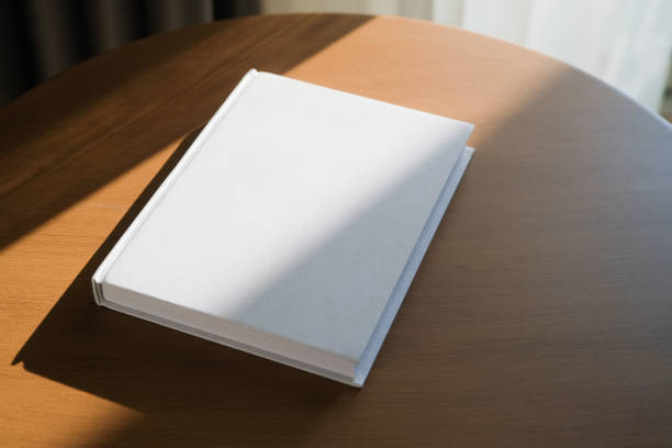 blank book mockup on wooden coffee table , shadow overlay