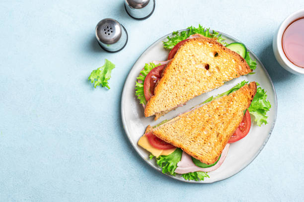 istock Healthy sandwich with ham, cheese and vegetables 2201933467
