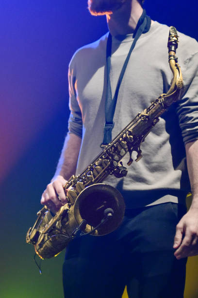 istock Jazz Saxophonist on Stage – Instrument in Focus 2201933475