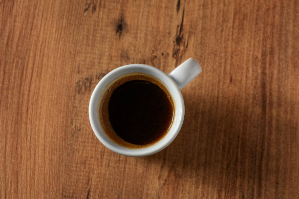 istock Enjoying rich moments with a steaming cup of coffee on a rustic wooden table 2201933774