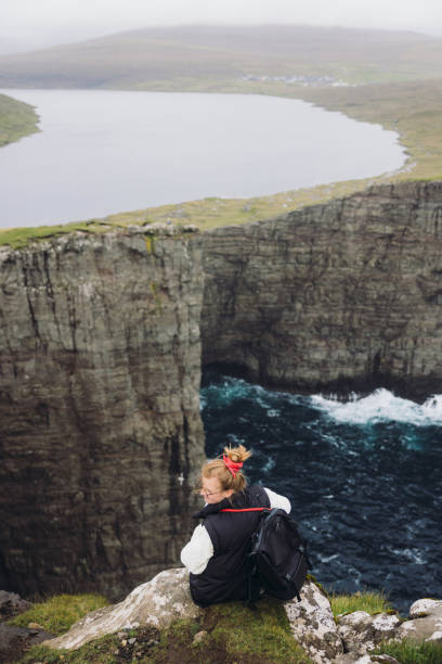 istock Traveller Admiring Majestic Mountain Lake Above Ocean 2201934628