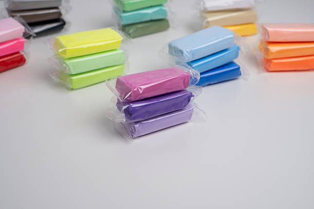 istock Set of colored plasticine for creativity. Plasticine dough for modeling in transparent packaging. Banner design 2201934857