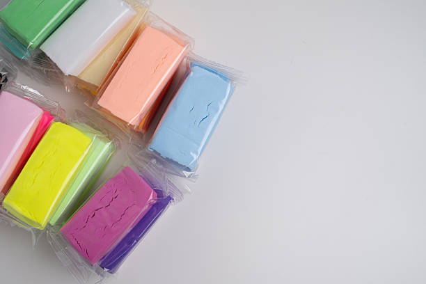 istock Set of colored plasticine for creativity. Plasticine dough for modeling in transparent packaging. Banner design 2201934858