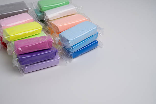 istock Set of colored plasticine for creativity. Plasticine dough for modeling in transparent packaging. Banner design 2201934861