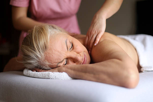 istock Senior woman having a massage 2201935863