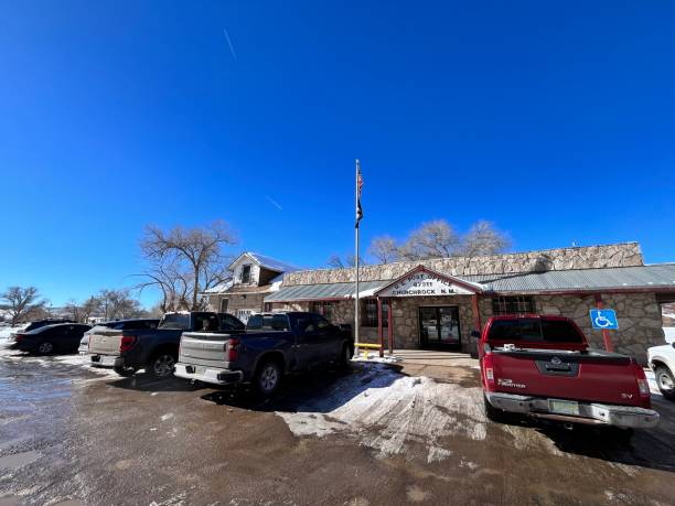 Gallup, New Mexico, United States of America USA - January 10: Cars parked in front of the Church Rock post office, located along the historic Route 66 in McKinley County, New Mexico, on a clear winter day