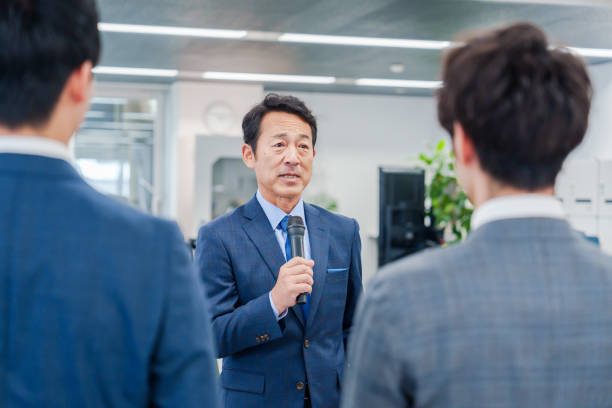 istock Man in a management position addressing a morning meeting in his office. 2201939687
