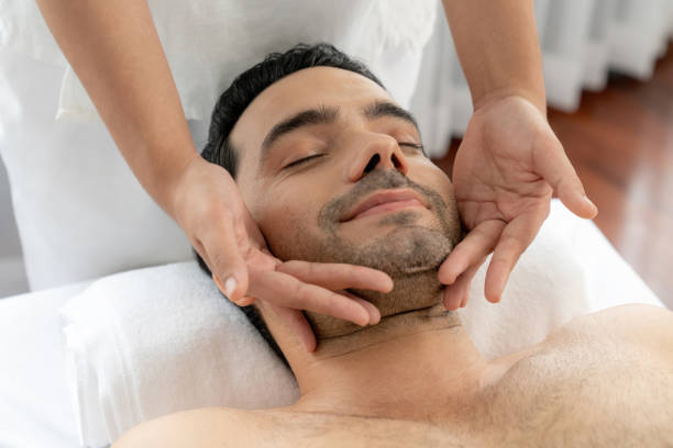 istock Caucasian man enjoying relaxing anti-stress head massage. Quiescent 2201940312