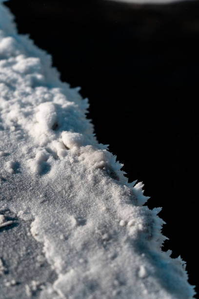 istock Frost on concrete. Snow from the waterfall. Frozen water 2201940586