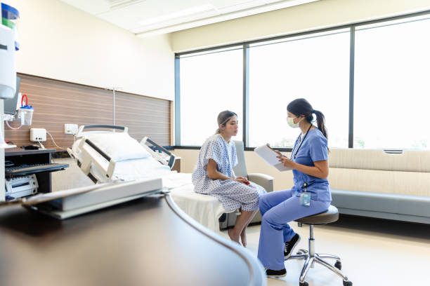 istock Doctor and Patient Talking in Hospital Room 2201942245