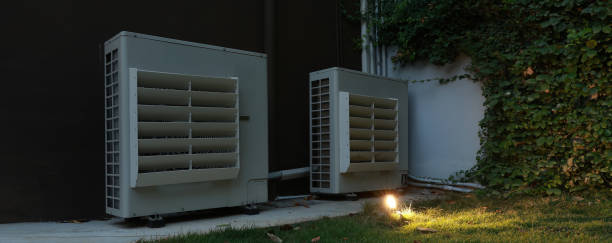 istock Air conditioner compressor installed in old building. Outdoor split wall type air conditioner compressor unit inverter installed on the outside of the building. Air conditioner compressor outdoor unit 2201943079