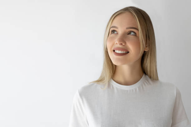 istock Young beautiful woman looking away and laughing positively 2201944174