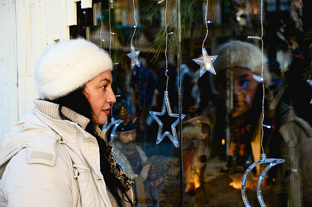 SHOP WINDOW REFLECTION AT CHRISTMAS IN TOLEDO, You can also see a small nativity scene.