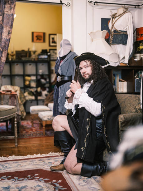 istock Young gay actor dressed in period costume inside design studio 2201945548