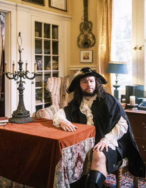 istock Young gay actor dressed in period costume inside design studio 2201945616