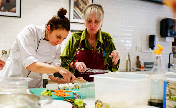 istock Chef Guiding Senior Participants in a Hands-On Cooking Class 2201947514