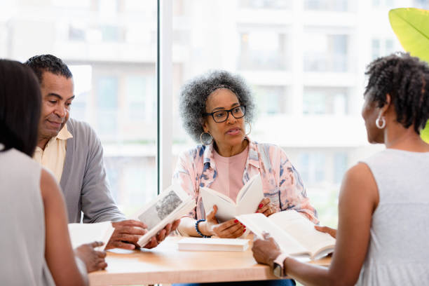 istock Multiracial Group of Adults Engaging in a Book Discussion 2201948326