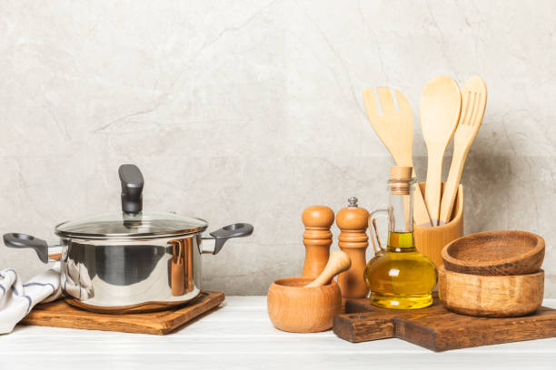 istock Stainless steel saucepan on light kitchen background. Modern saucepan. Kitchenware. Cooking pot. Cooking concept. Mockup. Space for text. Copy space. 2201949728