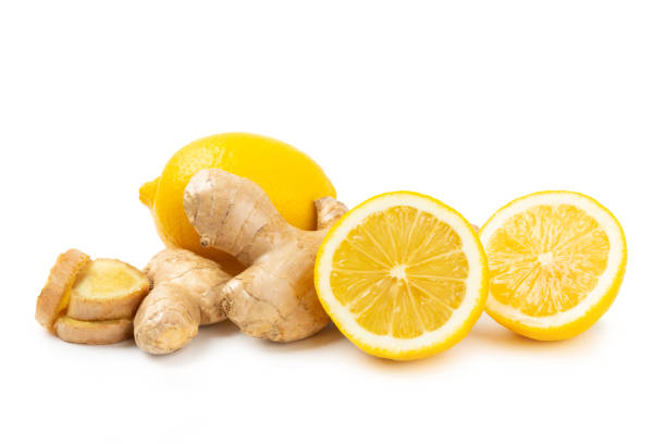 istock Fresh ginger and lemon isolated on white background. Sliced ​​ginger. Ginger root. Traditional alternative medicine, healing tea for immunity. Close-up. 2201949780