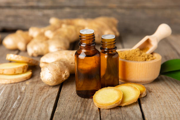 istock Ginger essential oil on texture background. Fresh ginger slices. Essence, serum, oil. Alternative medicine. Phytotherapy. Health and beauty concept. Place for text. Copy space. 2201949852