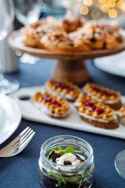 istock A beautifully arranged table features a stunning jar filled with delicious foods and a plate of delightful sweet treats, creating an inviting display of culinary wonders 2201950957