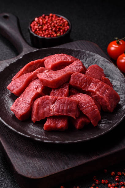 istock Raw beef tenderloin cut into slices with salt and spices 2201952264