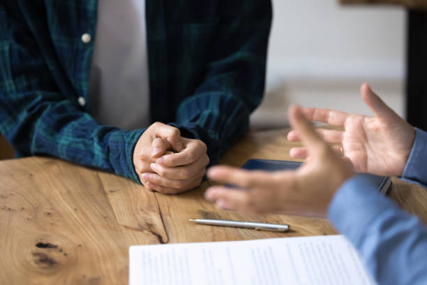 istock Unknown woman gesticulates while talk at formal meeting in office 2201953718