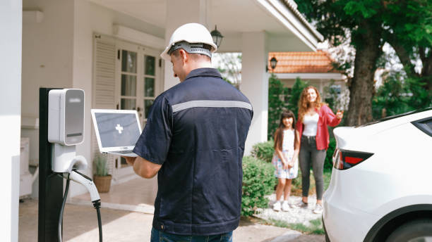 istock Qualified technician working with laptop for home EV station. Synchronos 2201953795