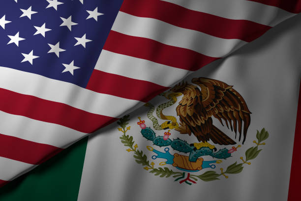 istock Overlapping USA and Mexico flags symbolizing diplomatic relations 2201954187