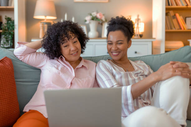 istock Relaxed Friends Watching Online Content on a Laptop 2201957269