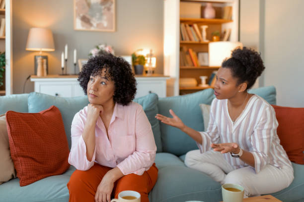 istock Tense Female Friends Arguing at Home 2201957360