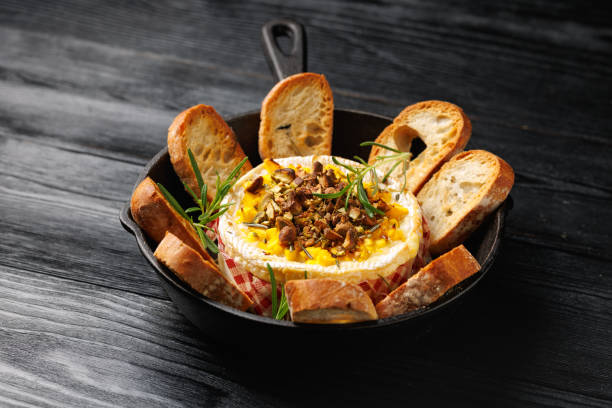 istock Baked Camembert cheese with mango and pistachio 2201957840