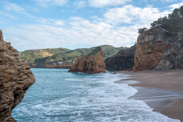 istock Waves crashing on a secluded beach in costa brava, spain 2201958879