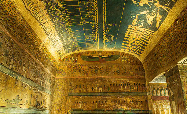 Ornate carvings and paintings on tomb of Seti I in Luxor stock photo
