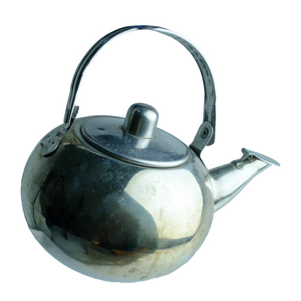 A classic vintage metal teapot featuring a curved handle and spout displayed against a white background. Perfect for concepts of tradition, relaxation, or tea culture.
