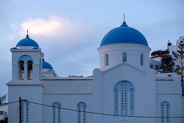 Panoramic view of the beautiful whitewashed Cathedral Church in Ios Greece and a beautiful blue sky in the background