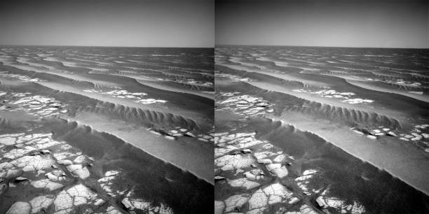 Mars Meridiani Planum sand dunes and rocks. Mars Exploration Rover Mission, Opportunity rover. Stereo pair of photos can be used for 3D imaging or images can be used separately.\nOriginal images \nhttps://an.rsl.wustl.edu/merb/AN/imDisp.aspx?m=1&it=B1&ii=1N333433492RADALS9P1767L0C1&is=IsiBrowse\nhttps://an.rsl.wustl.edu/merb/AN/imDisp.aspx?m=1&it=B1&ii=1N333433492RADALS9P1767R0C1&is=IsiBrowse\nCourtesy of NASA/JPL-Caltech