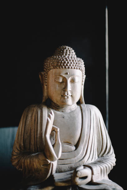 istock Serene wooden Buddha statue with intricate details and meditative expression, traditional Asian religious art, spiritual symbol of enlightenment and inner peace, cultural heritage craftsmanship 2201966886