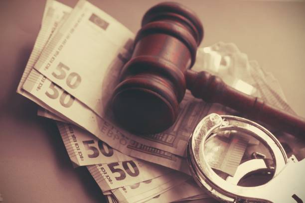 istock Gavel and four euro banknotes.Auction bidding, judicial system corruption concept.Toned 2201969098