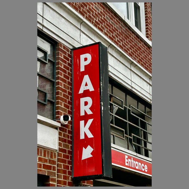 istock Red Parking Sign on Brick Building 2201972568