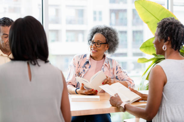 istock Diverse Group of Seniors Engage in Book Club Discussion 2201973554