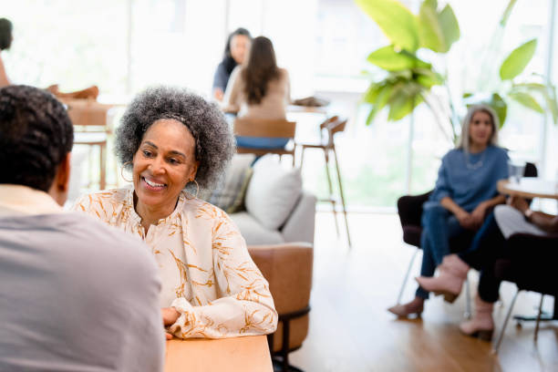 istock Smiling mature woman having a conversation, therapy session 2201973592