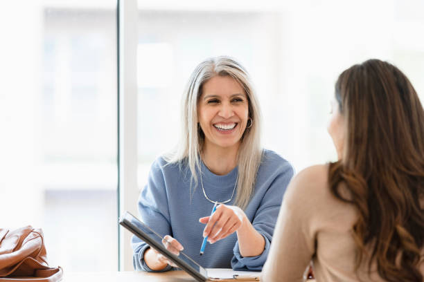 istock Happy mature woman using a digital tablet during a consultation 2201973596
