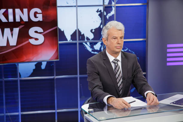 istock Breaking news senior male anchor 2201973824