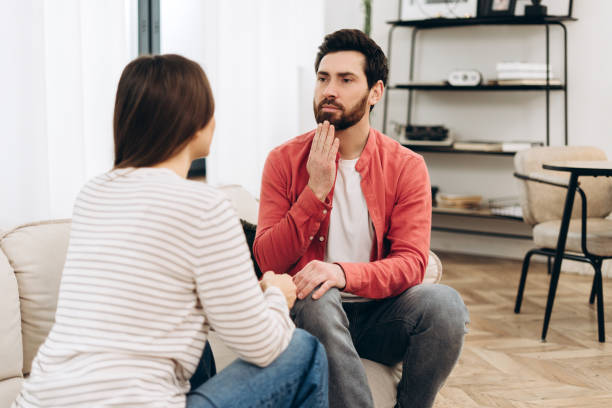 istock Young couple having a serious conversation at home 2201973839